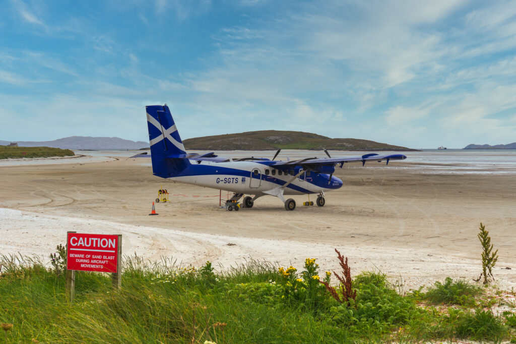 Small plane on the sandy runway of Barra Airport, Scotland